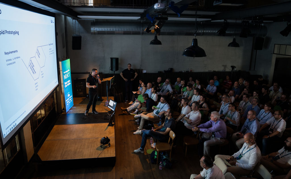 A packed Main Stage audience during the Day 1 session on AI rapid prototyping